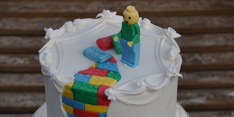 Lego cake with traditional royal icing and piping on it