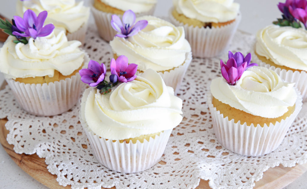 cupcakes with edible flowers on them