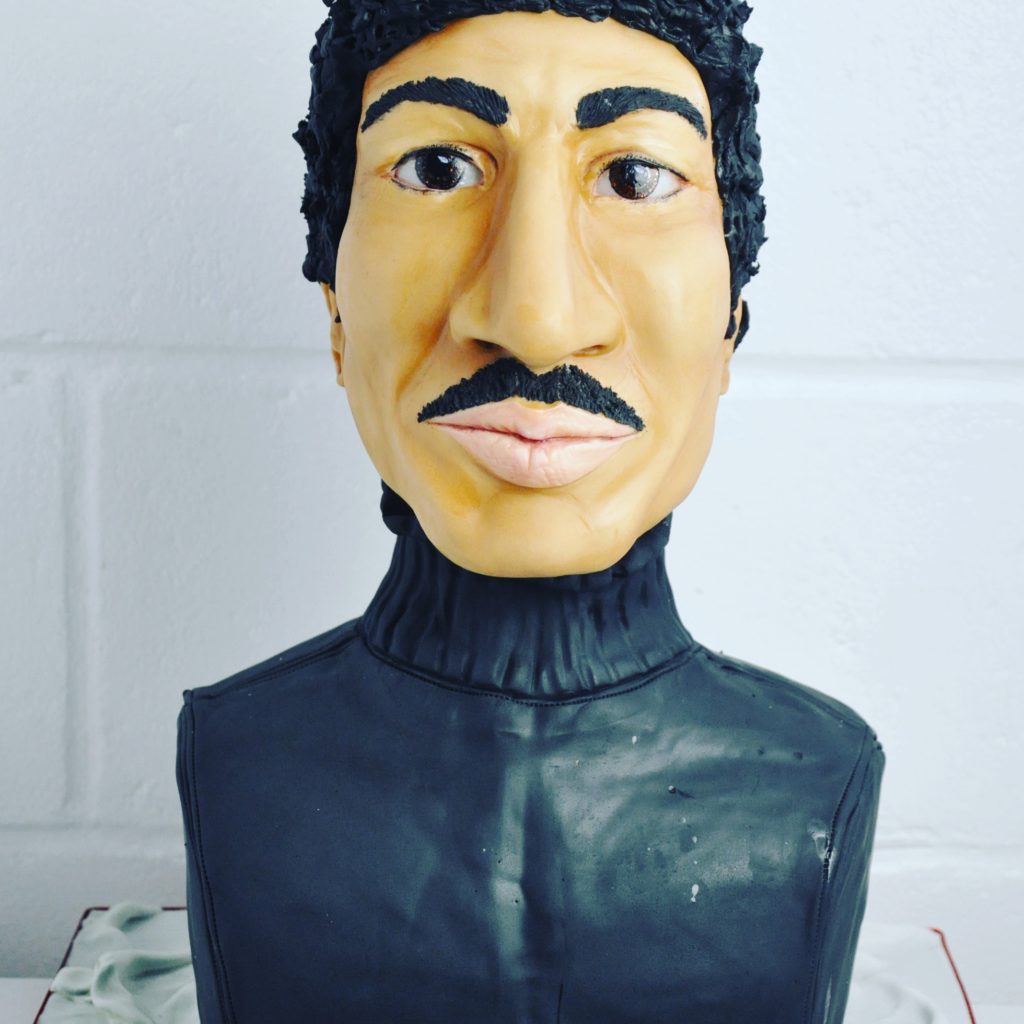 A 3D cake sculpted to look like Lionel Richie