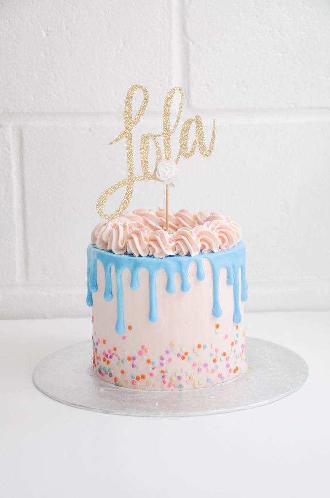 pretty pink cake with blue drip effect
