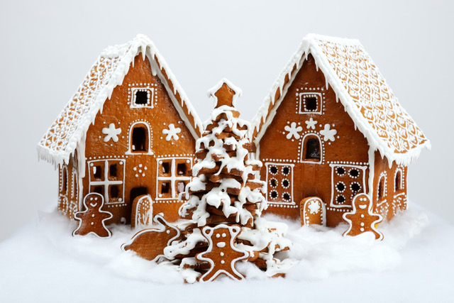 The hand-made eatable gingerbread houses and New Year Tree with snow decoration