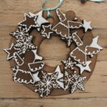 An edible gingerbread wreath made of star and angel cookies