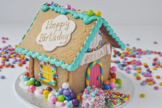 Side view of birthday gingerbread cottage showing birthday sign